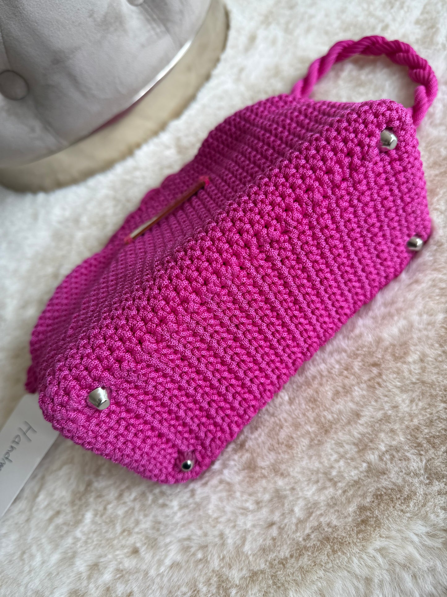 Borsa a mano Mamì Modello Fit fucsia con dettagli in metallo e texture intrecciata