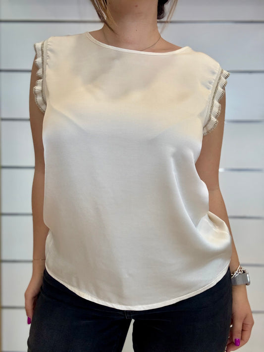 Maglia in viscosa panna con maniche a frange, elegante e versatile per ogni occasione
