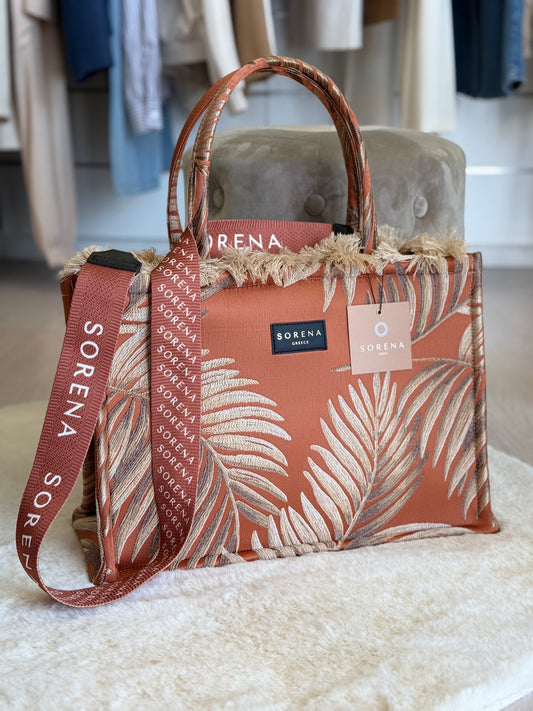 Sorena borsa a mano con stampa a foglia in tonalità terracotta e tracolla abbinata
