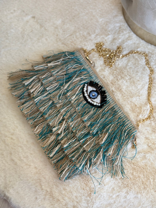 Pochette a mano Sorena blu elegante con frange colorate e applicazione ovale con occhio