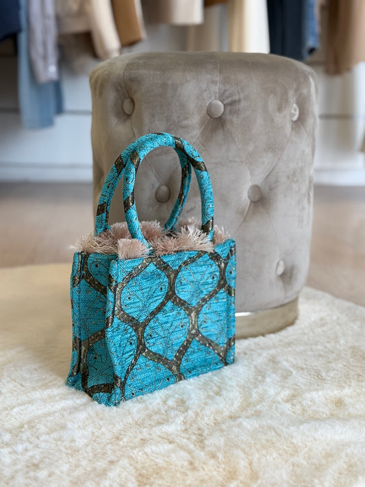 Borsa a mano e tracolla Sorena mini tote bag donna in blu con dettagli eleganti su uno sfondo neutro