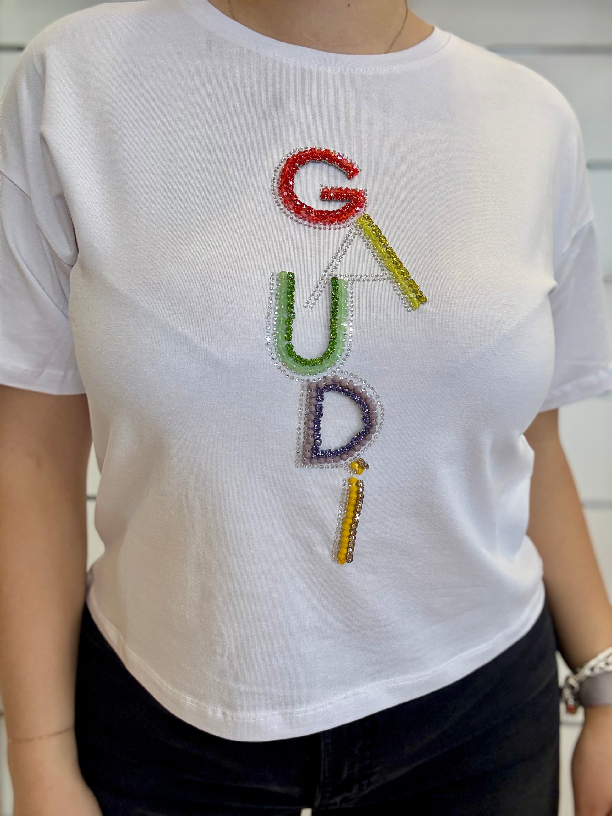 T-shirt donna bianca con logo e strass di Gaudì, design elegante e brillante perfetto per ogni occasione